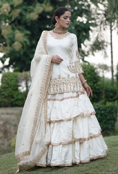 Cream White And Subtle Gold Embroidered Lehnga