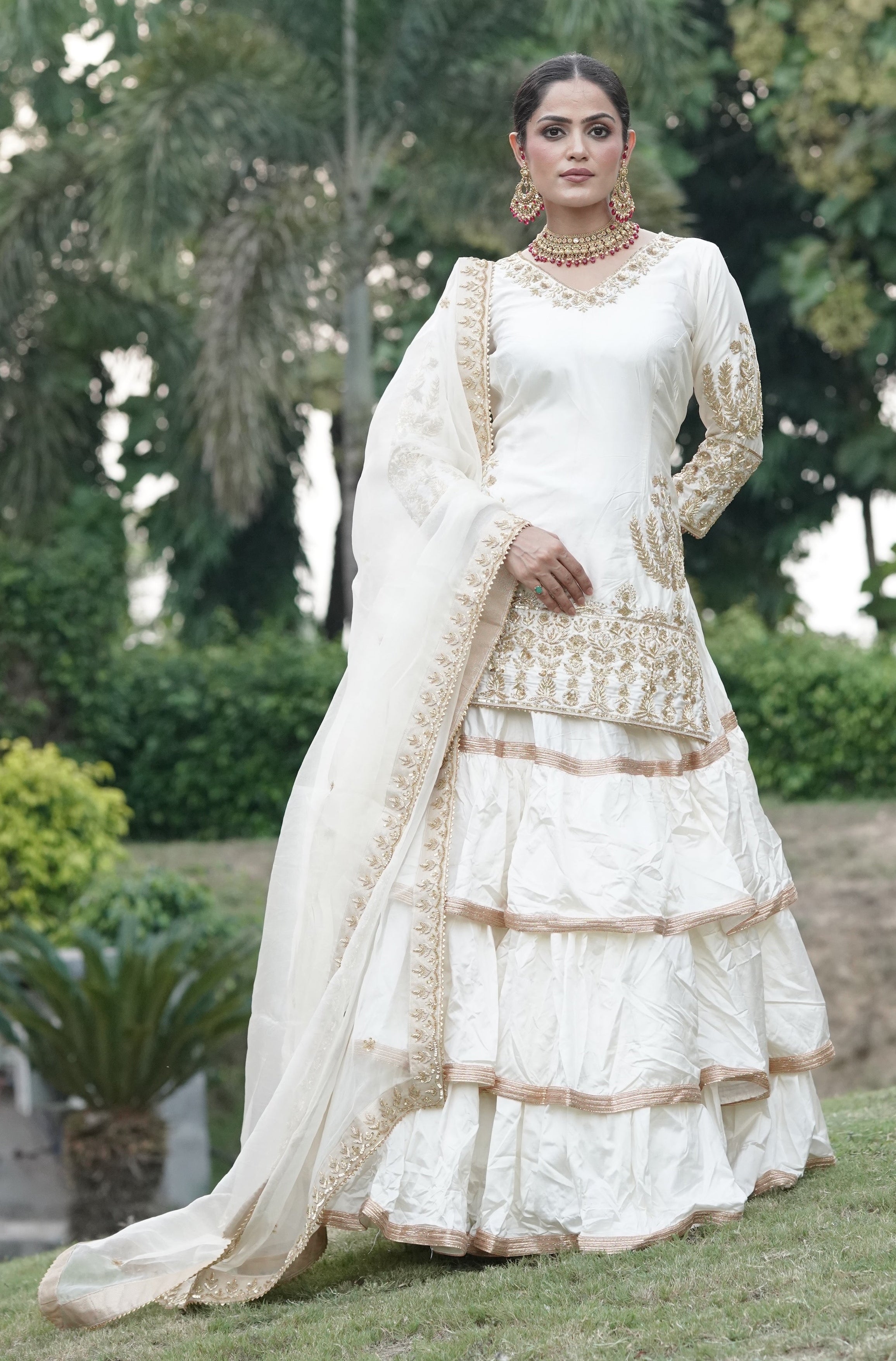 Cream White And Subtle Gold Embroidered Lehnga