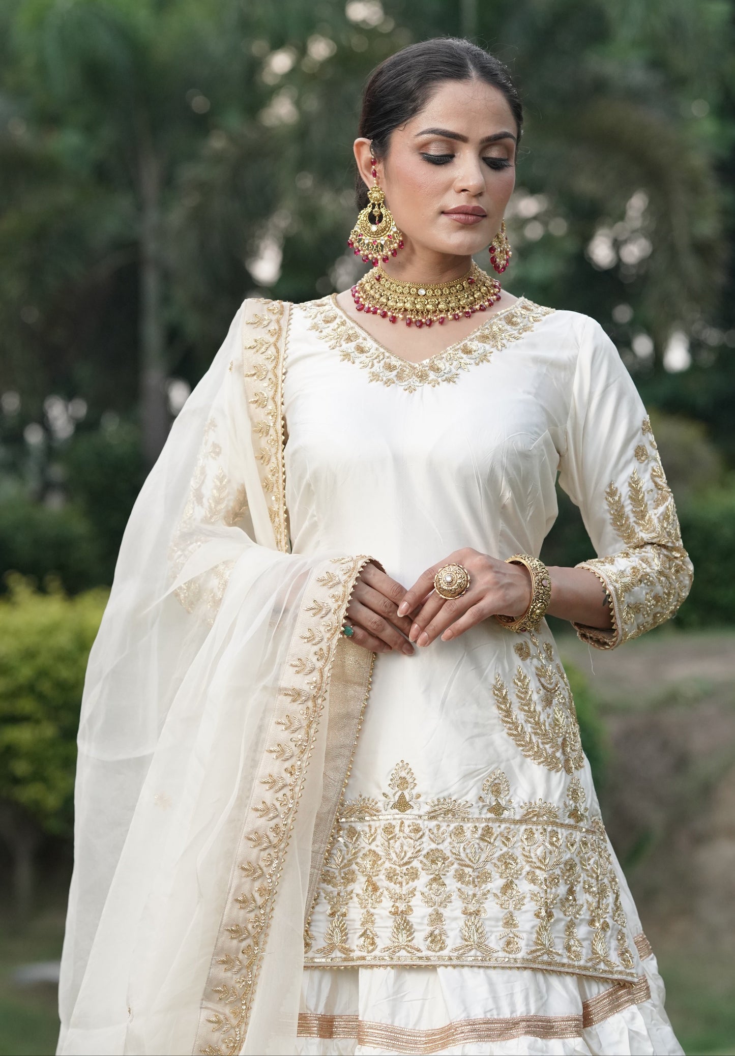 Cream White And Subtle Gold Embroidered Lehnga